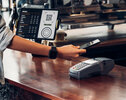 customer contactless payment for drink with mobile phone at cafe counter bar,seller coffee shop accept payment by mobile.new normal lifestyle concept